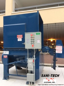 ST-10-40/30 mid-sized industrial trash compactor with 4.5 cubic yard hopper capacity